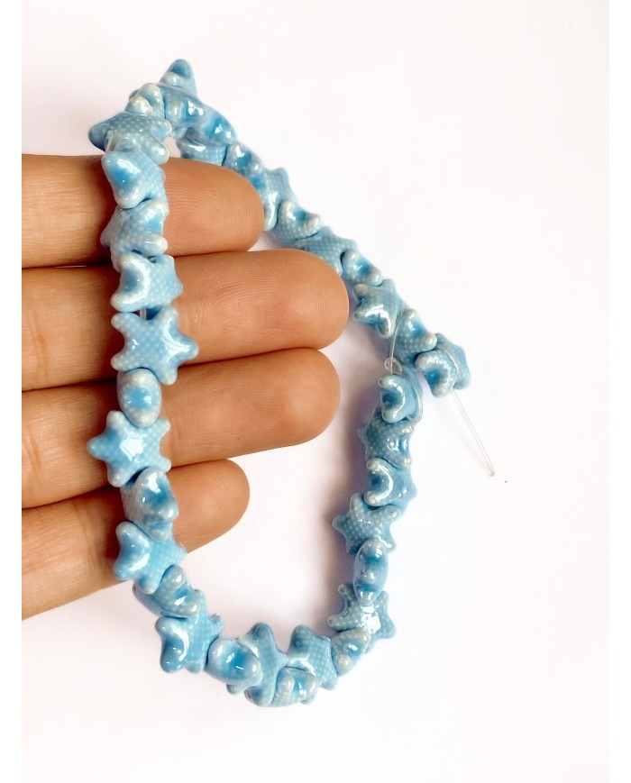 İpe Dizili Seramik Boncuk Mavi Benekli Yıldız 10mm - 1 Dizi