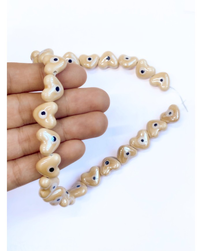 İpe Dizili Seramik Boncuk Krem Nazar Boncuklu Kalp 15mm - 1 Dizi